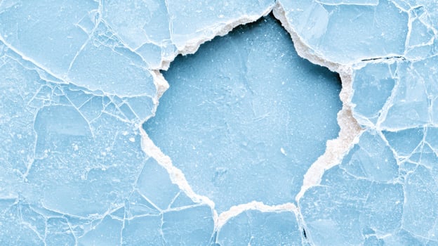 Frozen lake surface with cracked ice photo