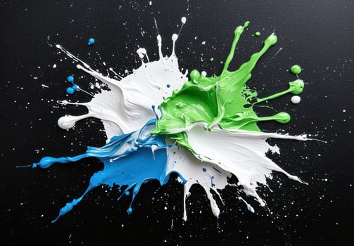 Colorful paint splash on black background photo