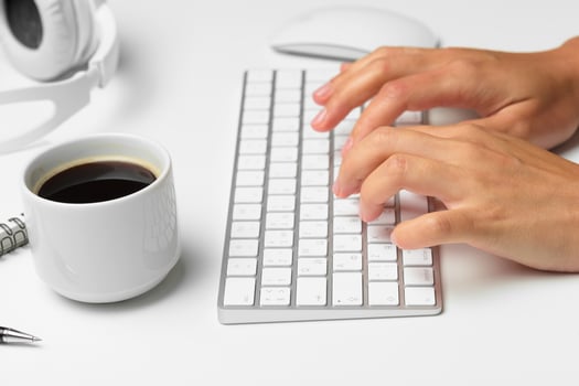 women's hands using keyboard and mouse photo
