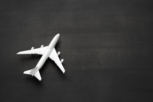 Miniature airplane on black background photo