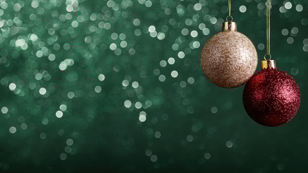 Festive christmas ornaments on green background photo