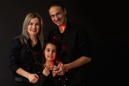 Family portrait on black background. photo