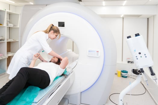 Female patient undergoing MRI - Magnetic resonance imaging in Hospital. Medical Equipment and Health Care photo