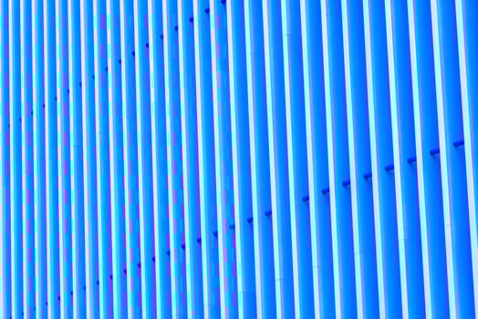 Detail of blue striped metal facade for background photo