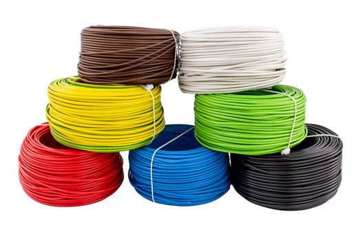Stacked Coils of Multicolored Electrical Wires on White Background photo