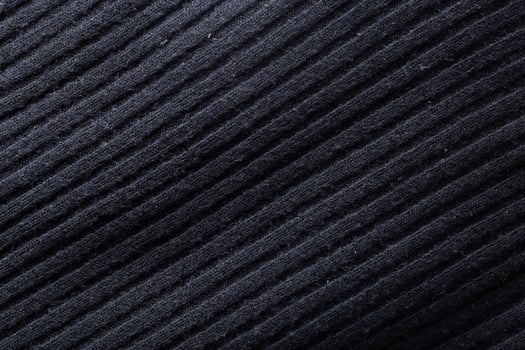 Black sweater in a line, background, macro, traditional photo