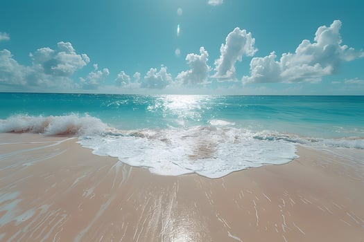 Serene Tropical Beach Wave with Turquoise Sea and Fluffy Clouds for Travel Posters photo