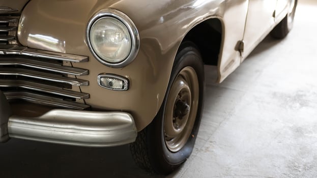 Headlight and hood of a Soviet restored retro car. Close-up photo