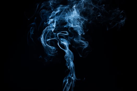 Smoke from flames or fog clouds graphic design art isolated on dark black background. photo