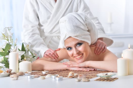 Beautiful woman in spa centar enjoying the massage. photo