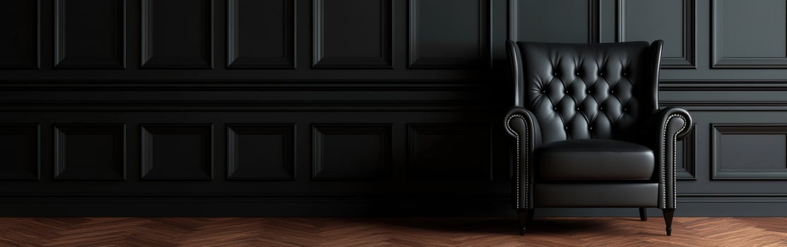 Elegant black leather armchair in a stylish dark interior setting photo