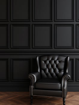 Elegant black leather chair against a dark paneled wall in a stylish room photo