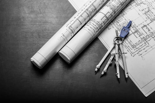 Construction planning drawings on black background photo