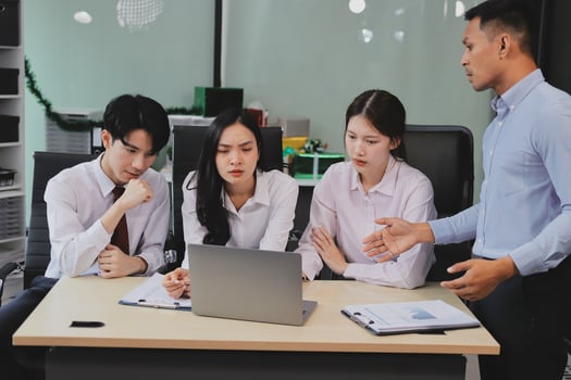 Frustrated upset multiracial business team people sad with bad work result in report disappointed in corporate bankruptcy failure crisis worried of paperwork problem sit at table at office meeting photo