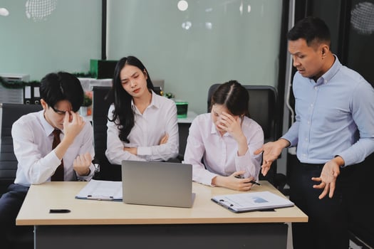 Frustrated upset multiracial business team people sad with bad work result in report disappointed in corporate bankruptcy failure crisis worried of paperwork problem sit at table at office meeting photo