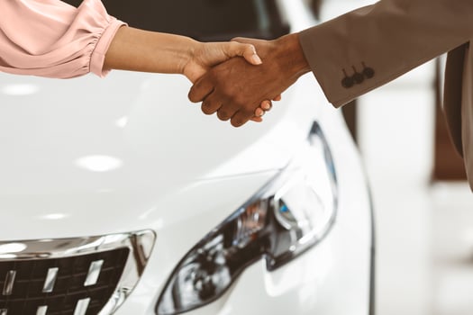 Car Buyer And Auto Seller Shaking Hands Buying Automobile In Luxury Dealership Store. Closeup, Cropped, Free Space photo