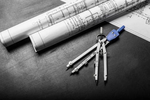 Construction planning drawings on black background photo