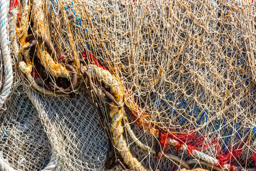 Old color fishing nets and ropes photo