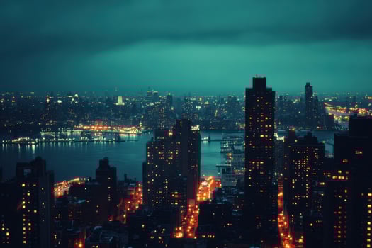 A view of a city skyline at night with a river in the foreground and skyscrapers in the background. photo