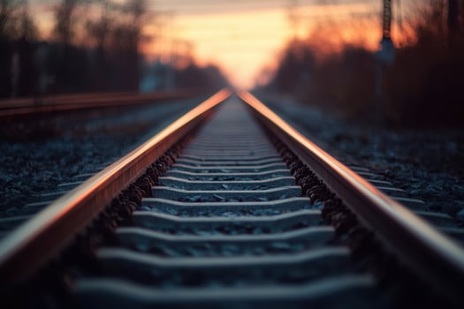 Railroad tracks vanishing into a sunset. photo