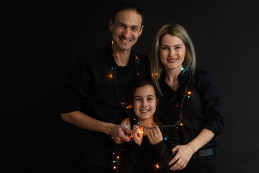 family with garland on a black background photo
