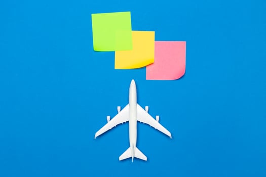 model of passenger plane on blue background photo