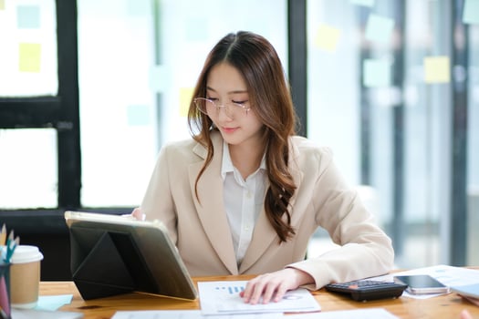 Businesswoman and entrepreneur using a tablet for data analysis and investment planning photo