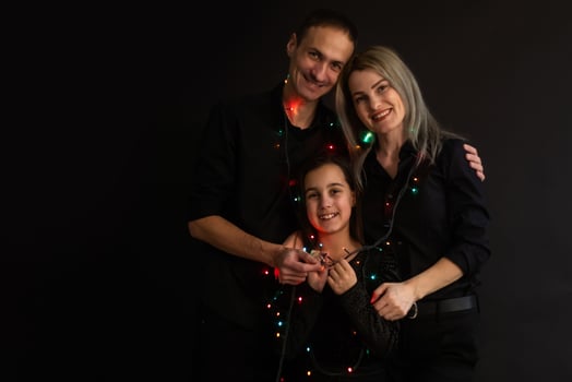 family with garland on a black background photo