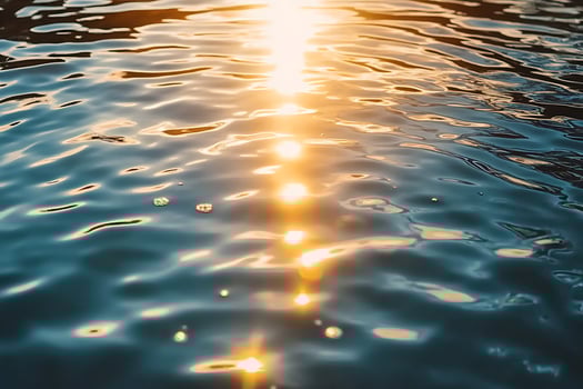Sunlight shining through water on a lake photo