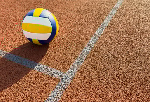 volleyball. blue with yellow color ball on the playground. volleyball cover, red. ball game photo