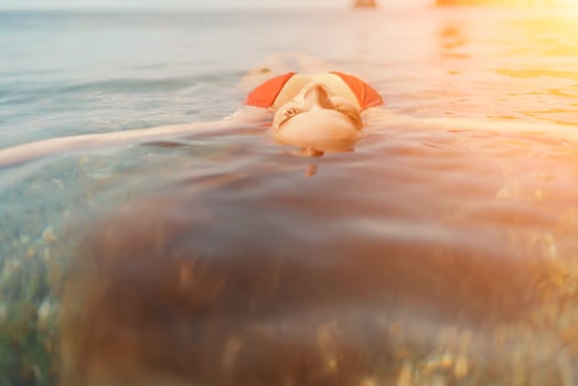 Happy woman sea relaxing floating in transparent sea water on summer holiday. Travel leisure recreation lifestyle, female in nature. photo