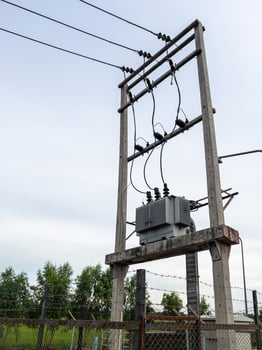 The electrical transformer installed on the concrete pole. photo