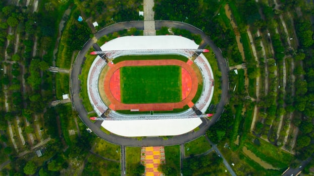 Aerial view of Palembang's largest soccer field, featuring a meticulously maintained green lawn. photo