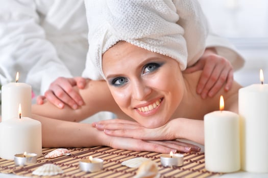 Beautiful woman in spa centar enjoying the massage. photo