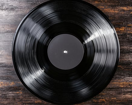 Vintage vinyl record on wooden background photo