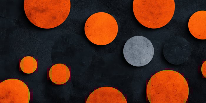 Vibrant orange and gray spheres on a dark background photo