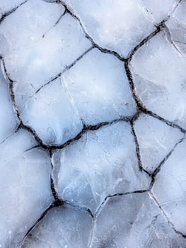 Cracked ice texture background photo