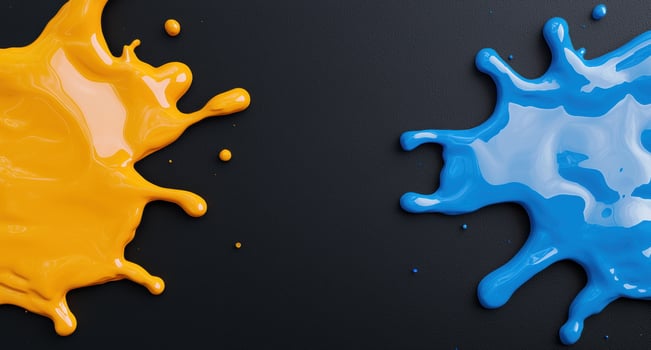 Colorful paint splashes on black background photo