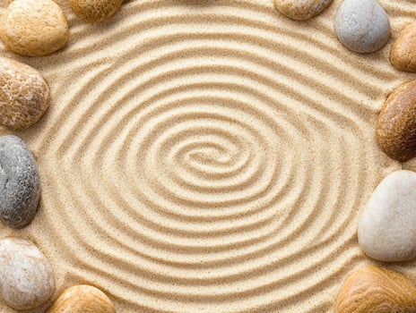 Zen garden with swirling sand and stones photo