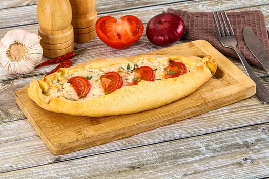 Turkish Pide with cheese and tomato photo