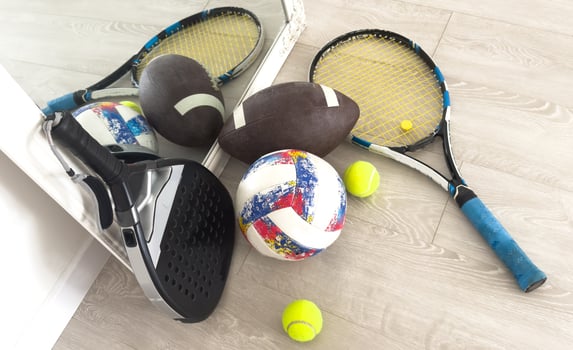 different modern sport equipment near beige wall photo