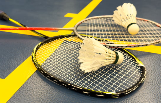 Competitive sports and high performance in tournament match conceptual idea with badminton rackets and shuttlecock with copy space photo