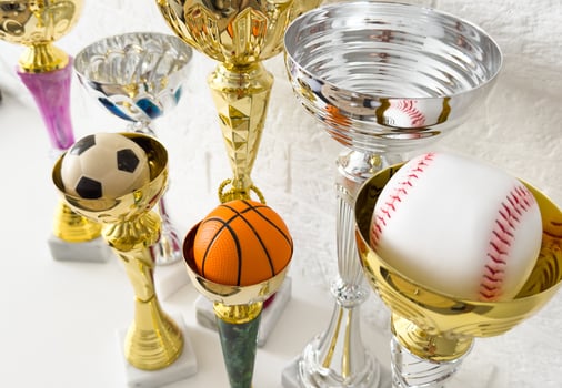cups and various balls trophy and soccer ball photo