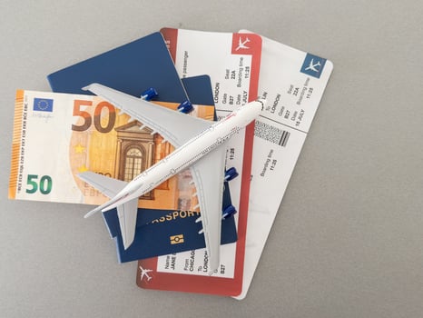 Concept Preparation for travel, money, passport, plane close-upselective focusholidays photo