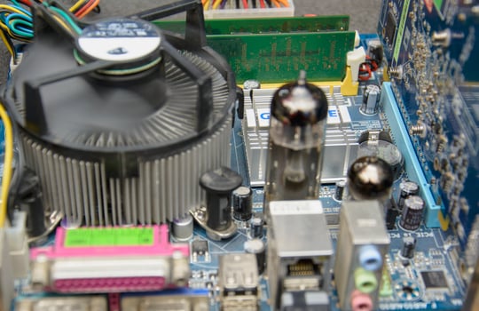 A close up of a computer motherboard with various components photo