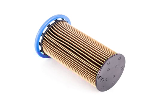 Dirty spent fuel car filter on white background, isolate. Concept of high quality car fuel, fuel cleaning, close-up photo