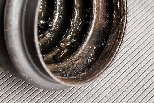 Old CV joint boot providing protection and dirt ingress into the constant velocity joint, macro photo