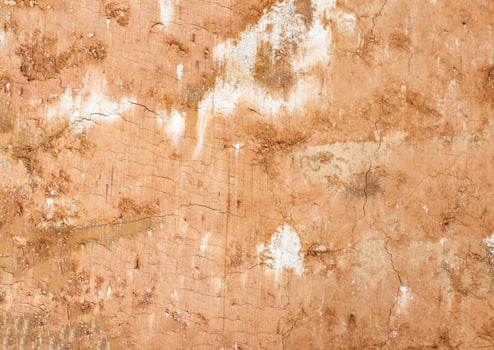 Clay soil background, orange soil, closeup, texture photo