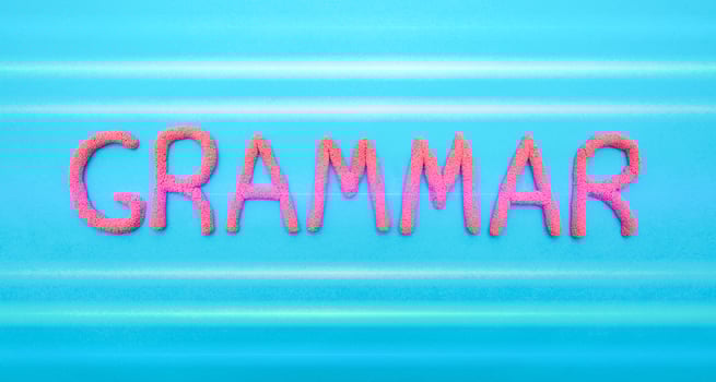 Grammar word in red letters on a blue background. Grammar and language learning concept, punctuation photo