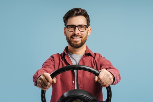 Smiling, positive, happy Hispanic man wearing stylish eyeglasses, holding helm, looking at camera photo